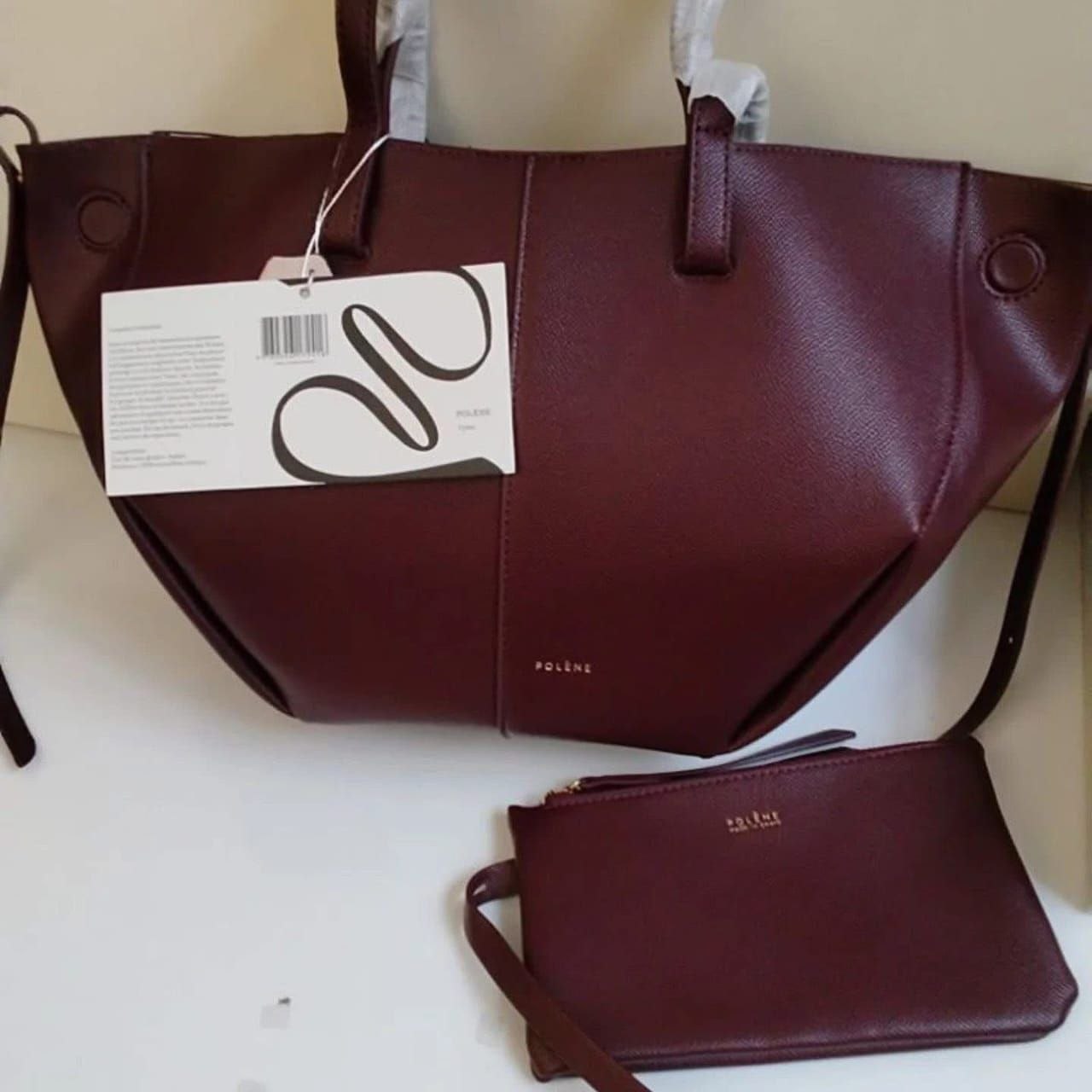 Polène burgundy leather tote bag with matching pouch - luxury designer handbag
