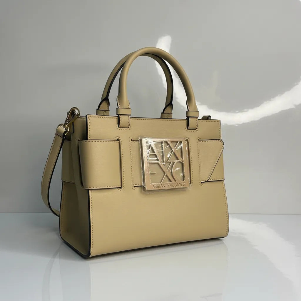 Beige handbag with a brand logo on a light gray background
