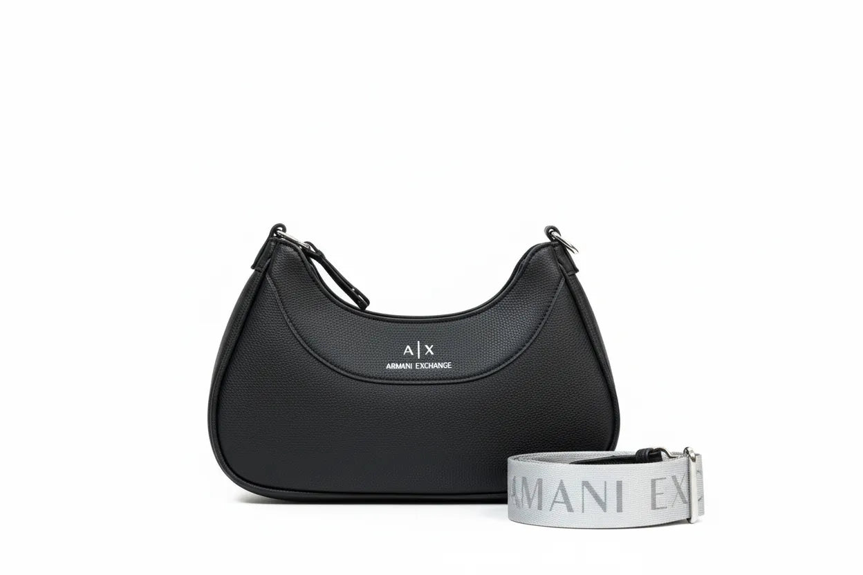 Black handbag with matching strap on a white background, featuring Armani Exchange logo.