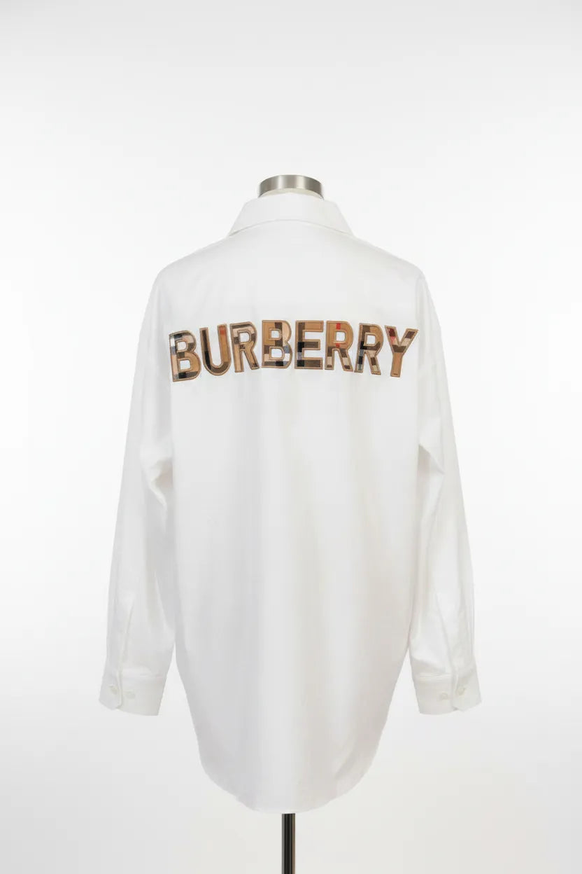 White shirt with 'Burberry' logo on a mannequin against a white background
