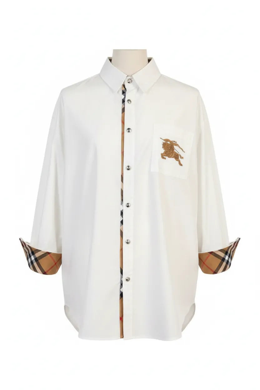 White shirt with Burberry checkered cuffs and collar on a mannequin against a white background
