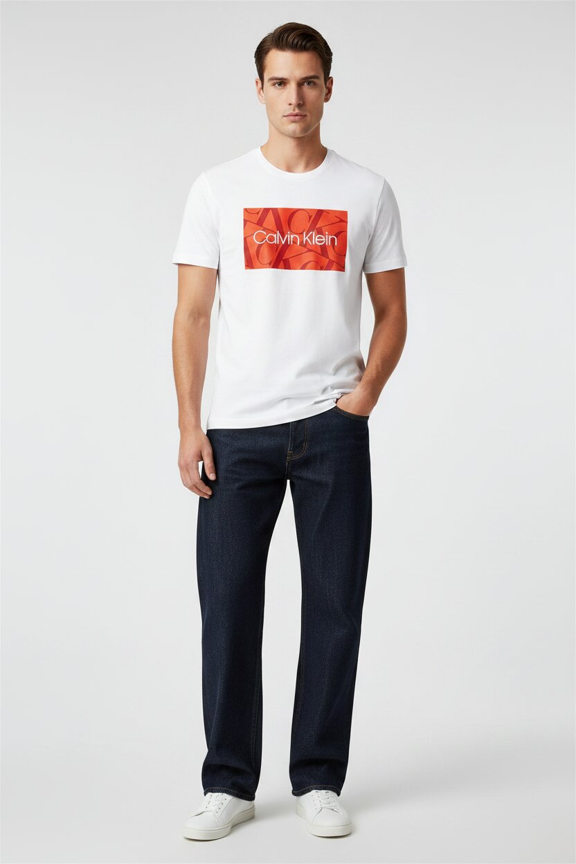 Man wearing a white Calvin Klein t-shirt with a red logo on a white background
