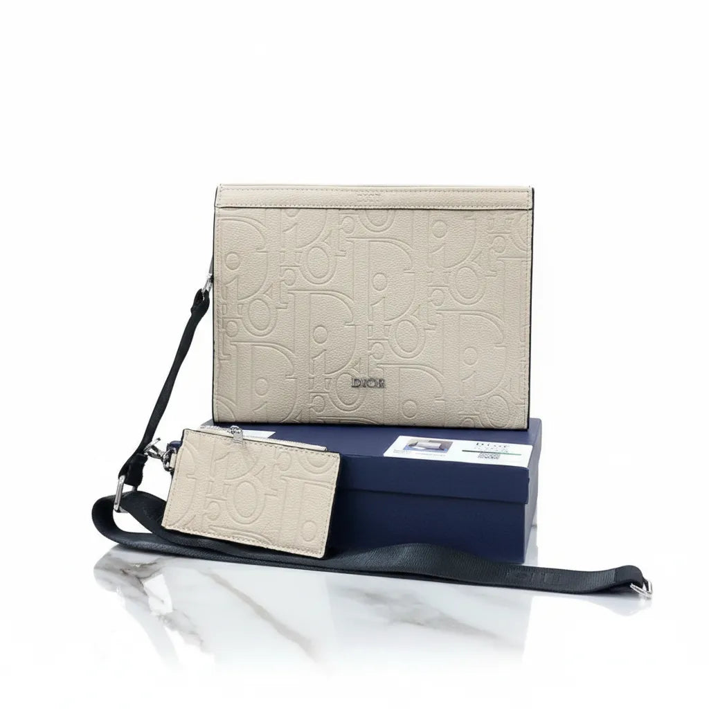 Beige handbag with black strap and matching cardholder on a white background
