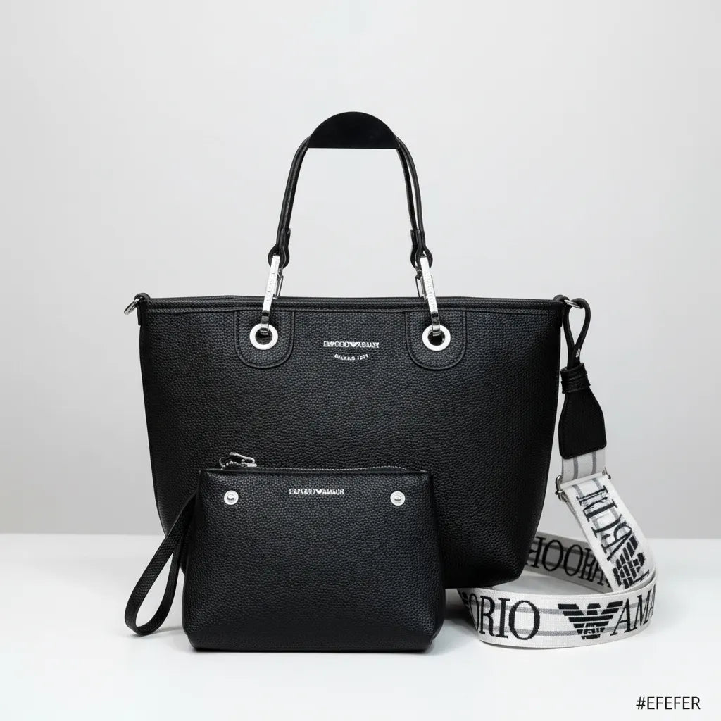 Black Emporio Armani handbag with matching pouch and strap on a white background