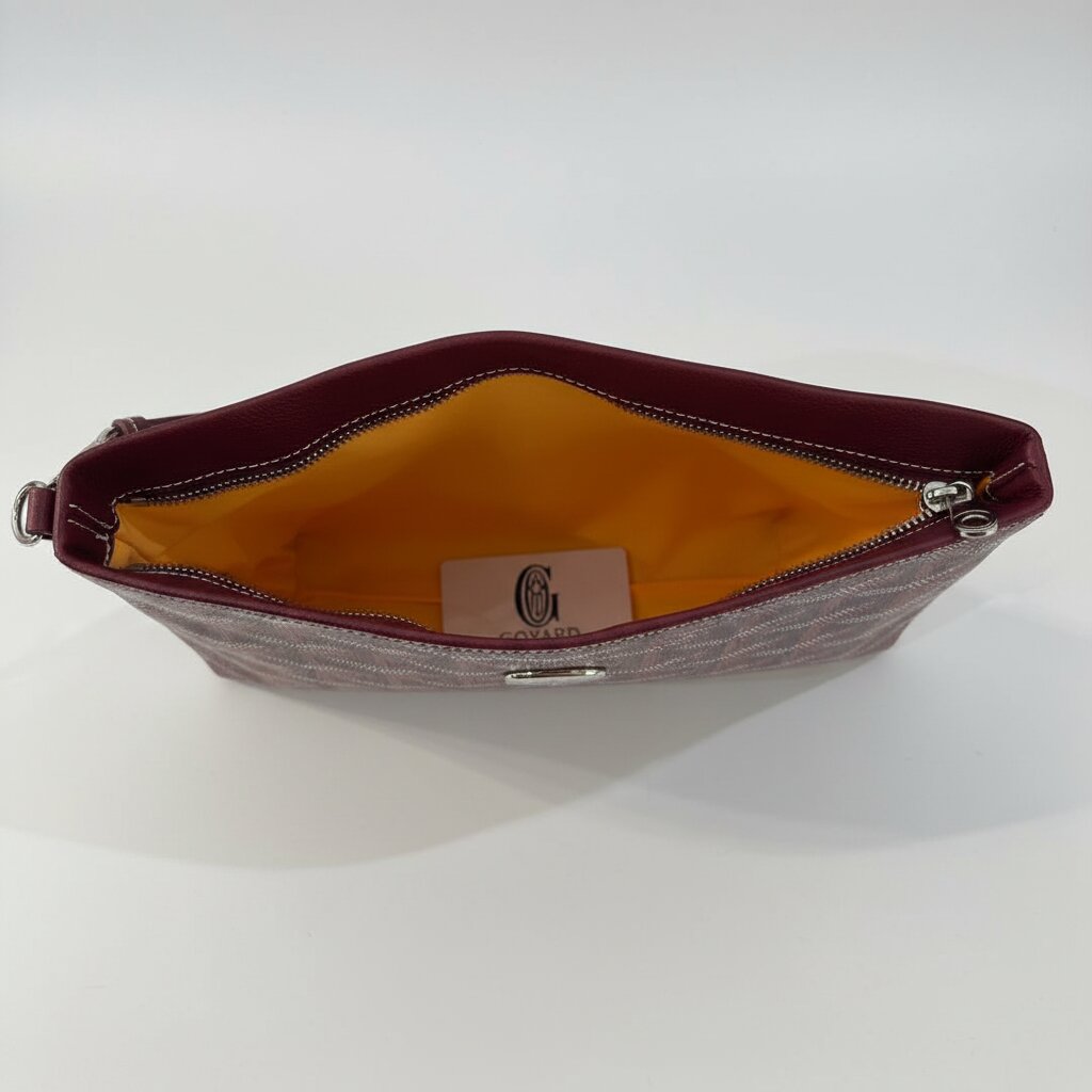 Goyard Senat Clutch Wristlet Bag in Burgundy - Open Interior Showing Mustard Yellow Lining and Goyard Authenticity Tag - Light Gray Background