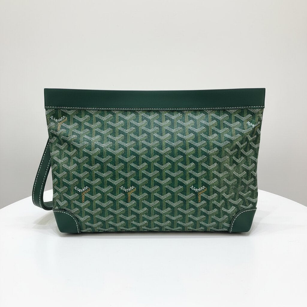 Goyard Senat Clutch Wristlet Bag in Forest Green Monogram Canvas - Close-up Canvas Texture and Goyard Logo Detail - Light Gray Background