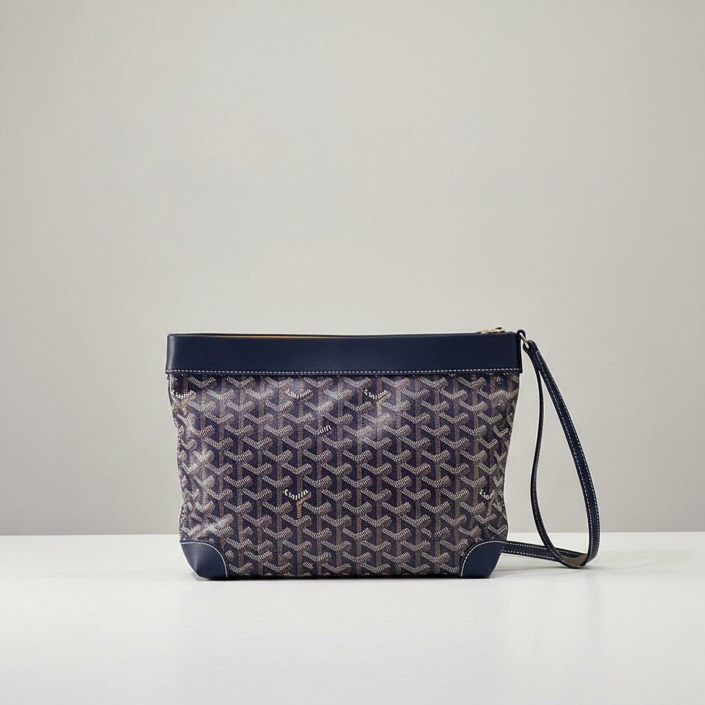 Goyard Senat Clutch Wristlet Bag in Navy Blue Monogram Canvas - Front Upright View with Wrist Strap - Light Gray Background