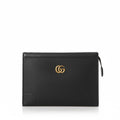 Black leather clutch bag on a white background