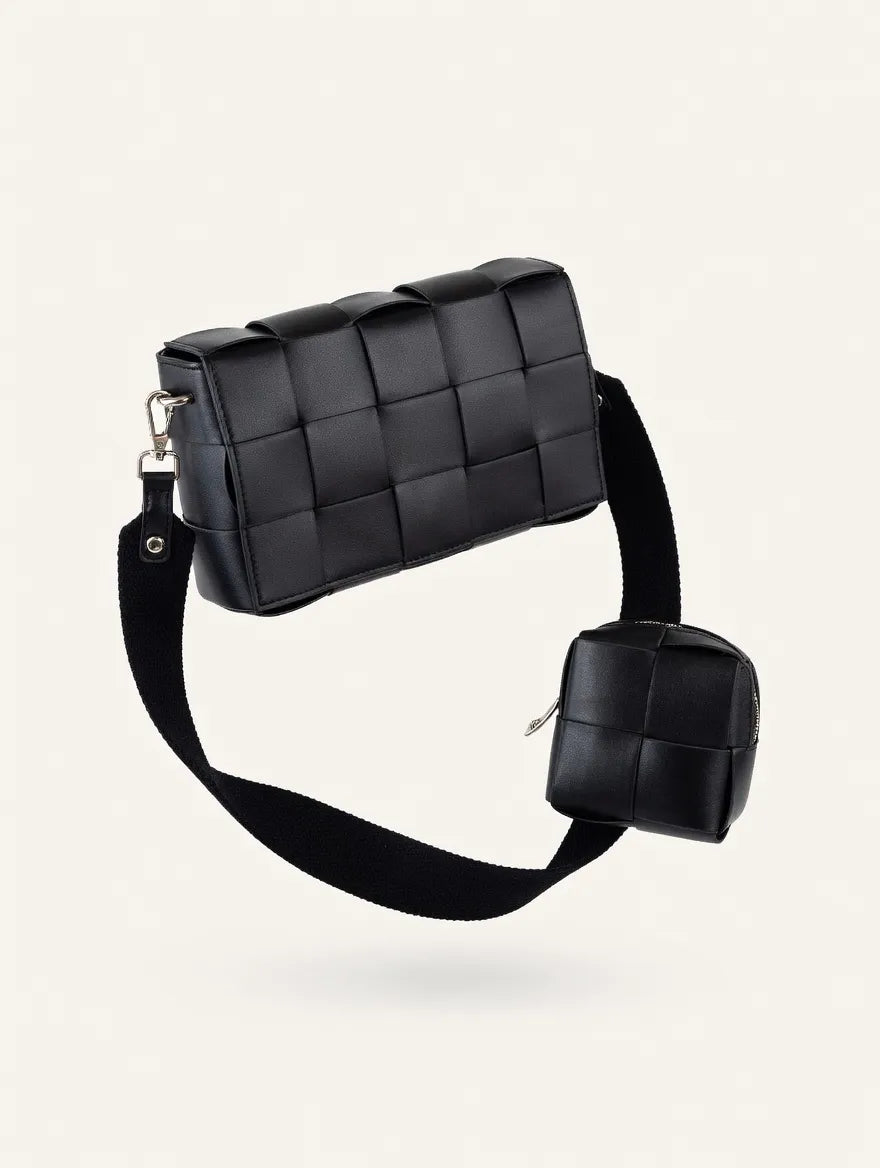 Black woven handbag with a matching pouch on a light beige background