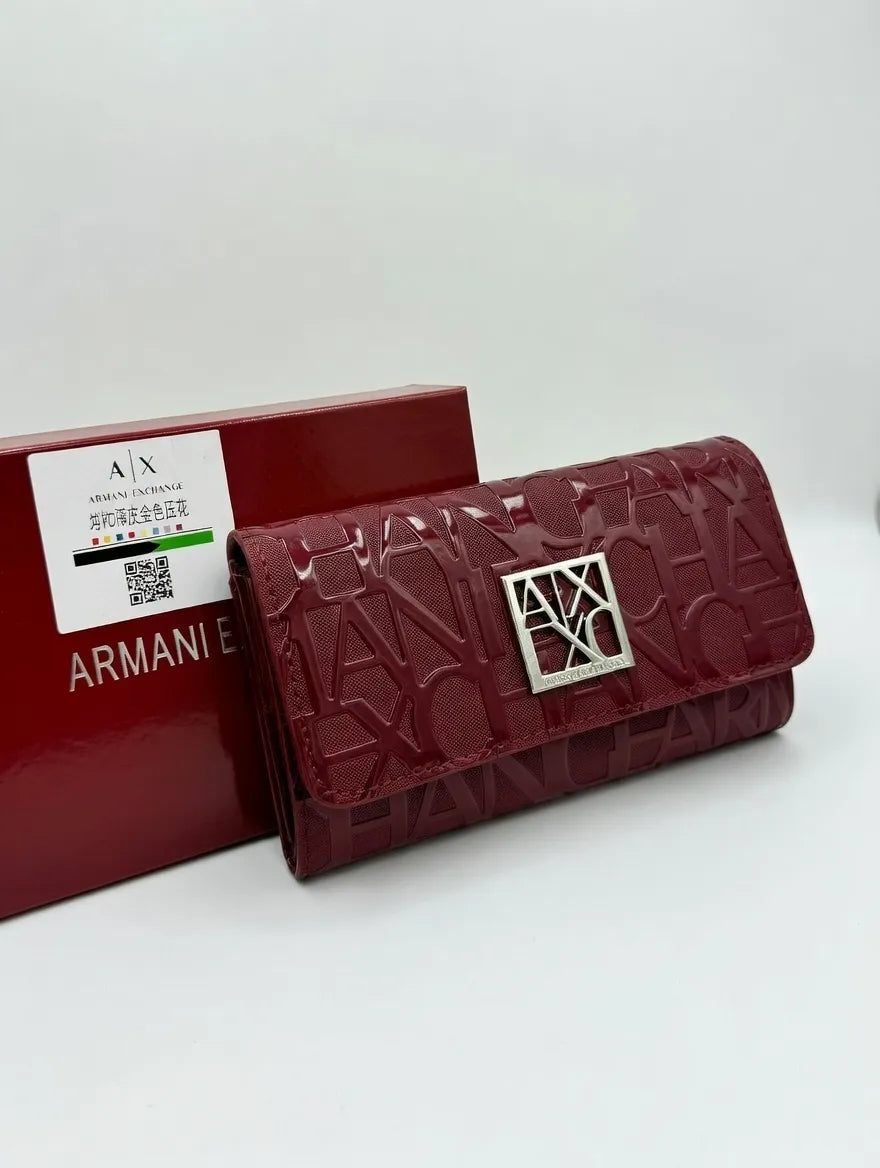 Red Armani wallet with branded box on a white background