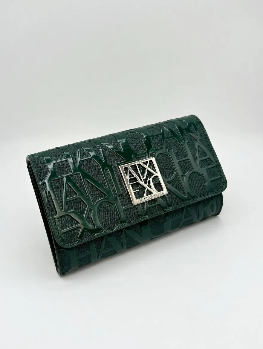Green wallet with a silver clasp on a white background
