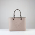 Loewe Anagram Tote Bag in Dusty Rose Pink Pebbled Leather with Rattan Handles - Light Gray Background - Front View