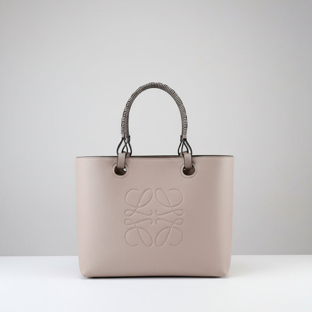 Loewe Anagram Tote Bag in Dusty Rose Pink Pebbled Leather with Rattan Handles - Light Gray Background - Front View