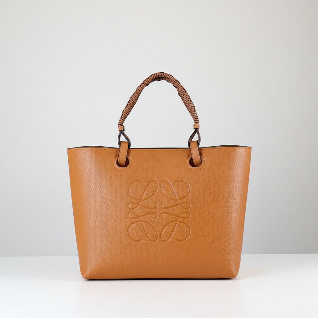Loewe Anagram Tote Bag in Tan Caramel Pebbled Leather with Rattan Handles - Light Gray Background - Front View