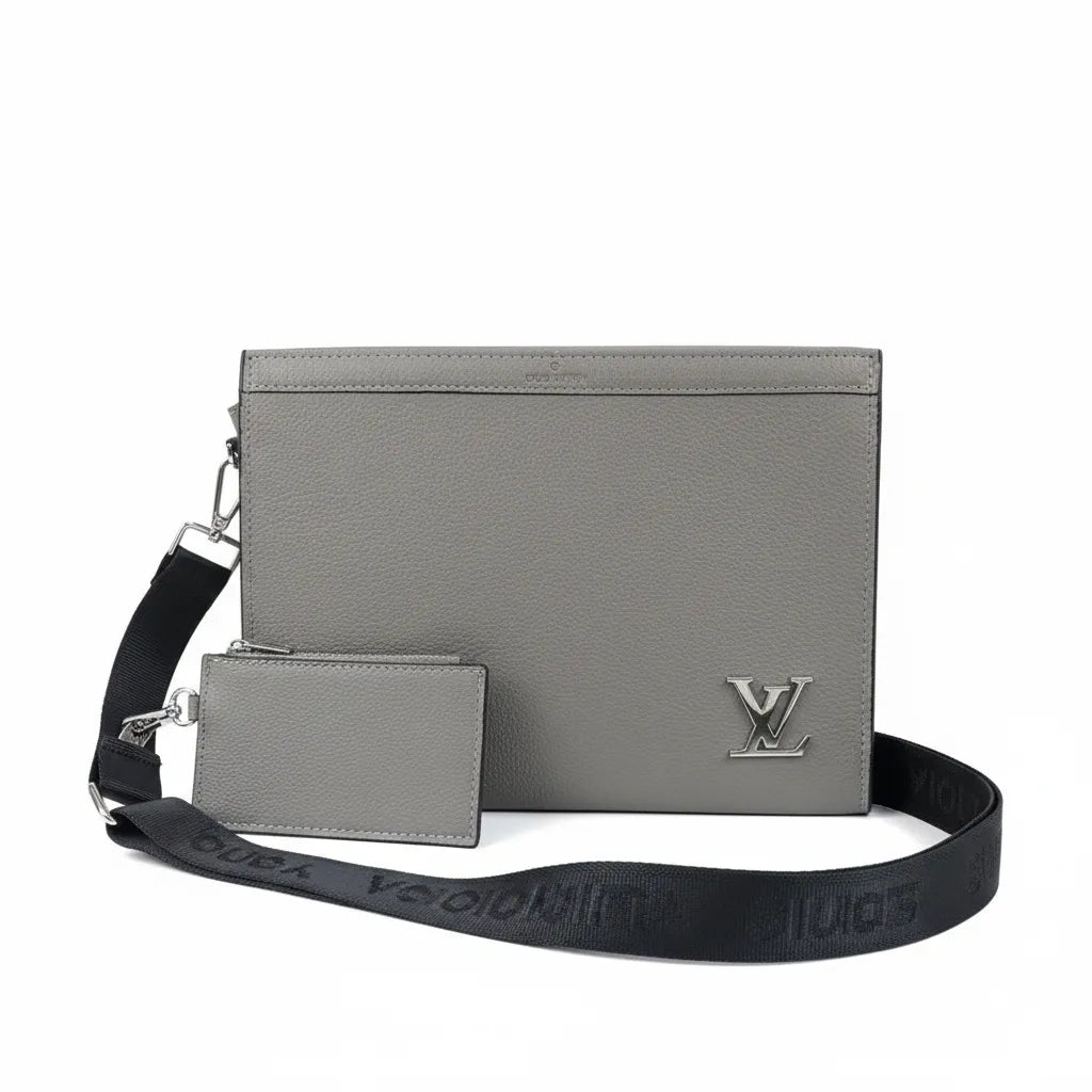 Gray leather pouch with matching cardholder and black strap on a white background