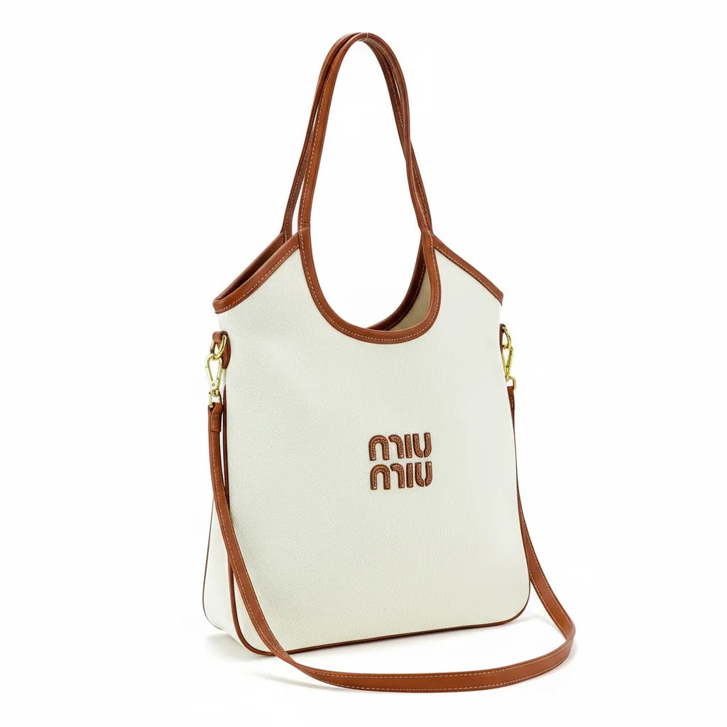 White handbag with brown accents and Miu Miu logo on a white background