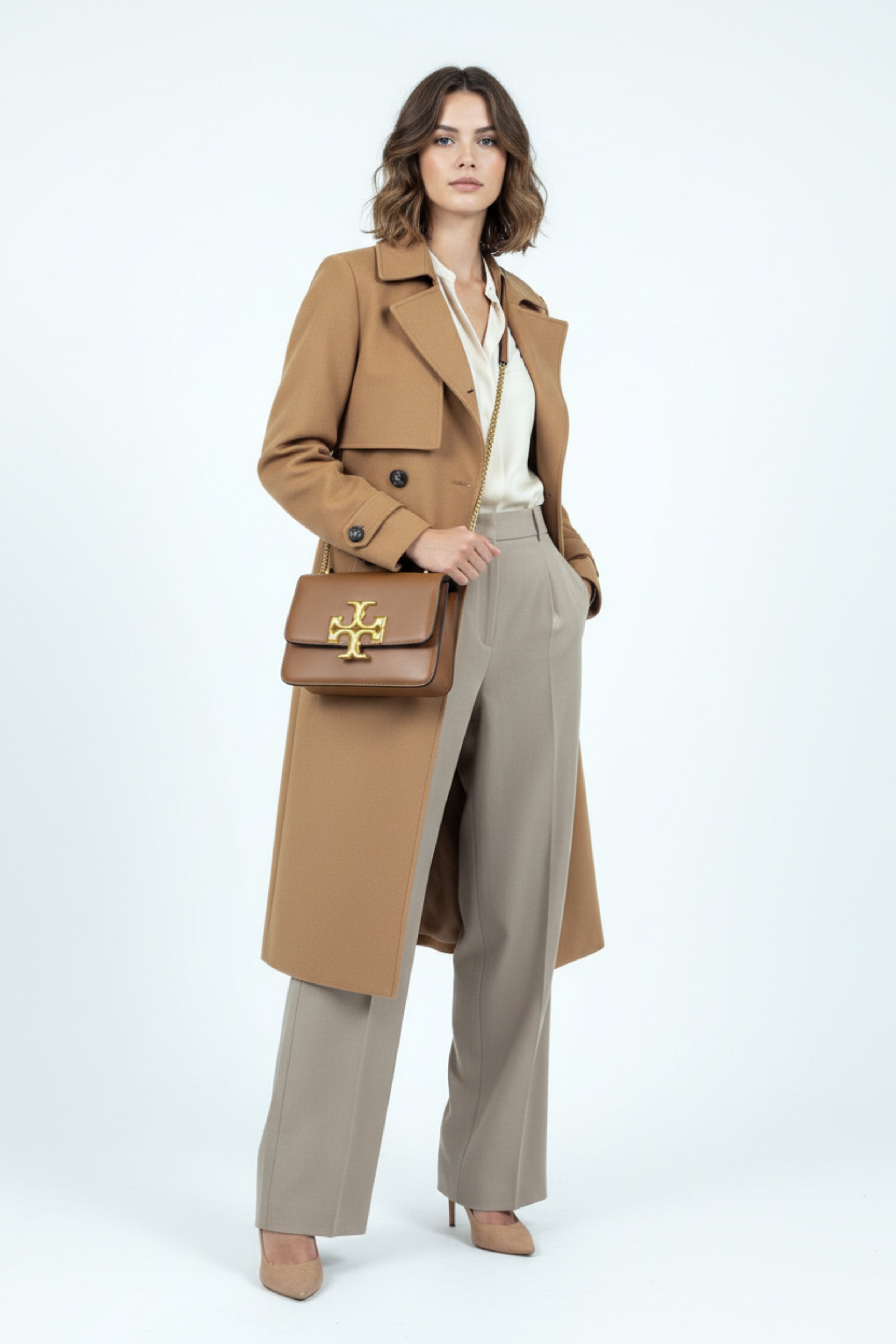 Stylish woman with Tory Burch Eleanor brown leather shoulder bag - professional photography
