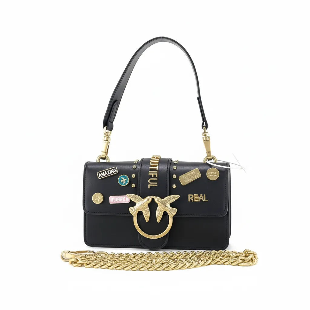 Black handbag with gold chain and decorative elements on a white background