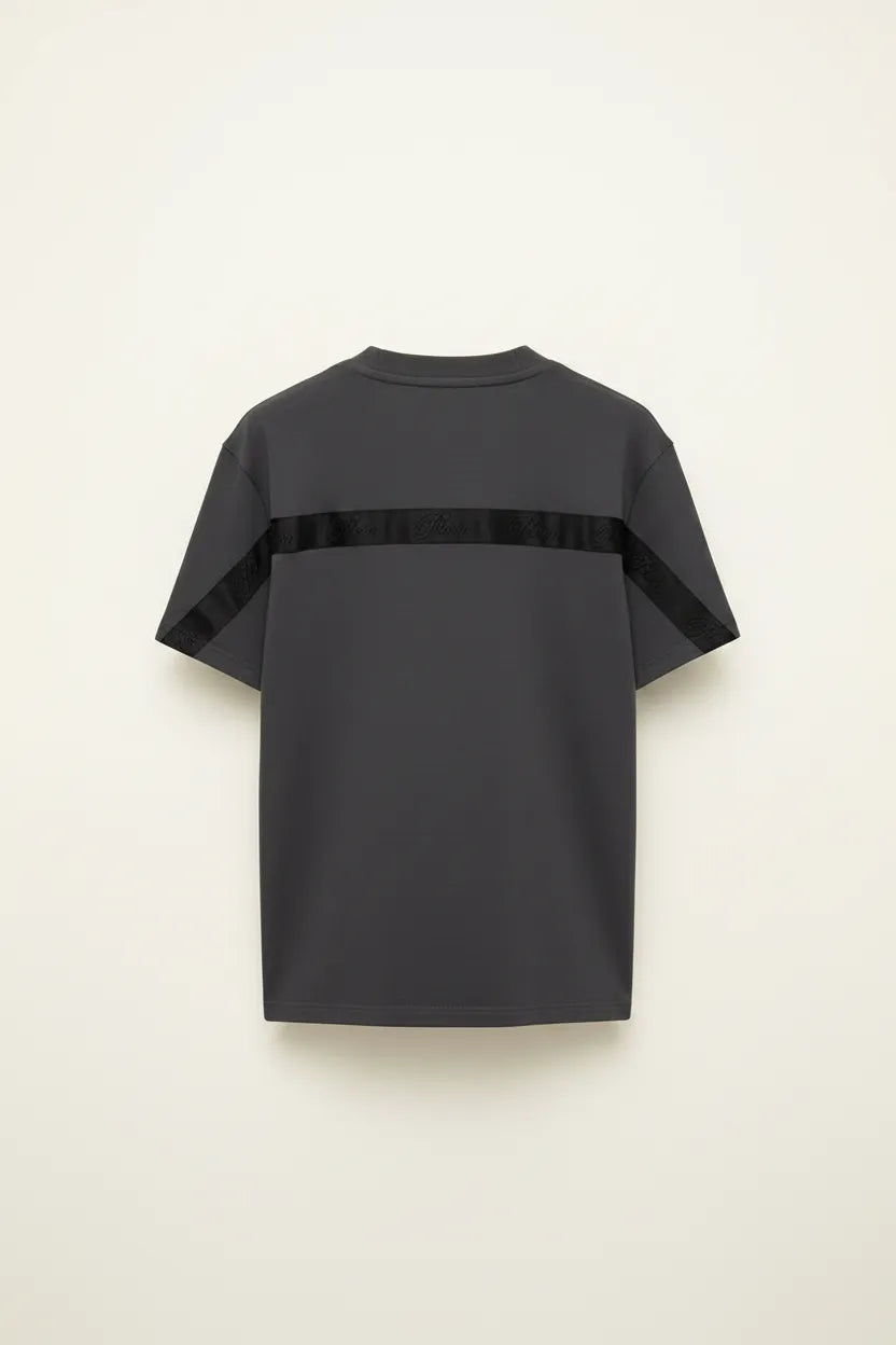 Black cape-style garment on a beige background