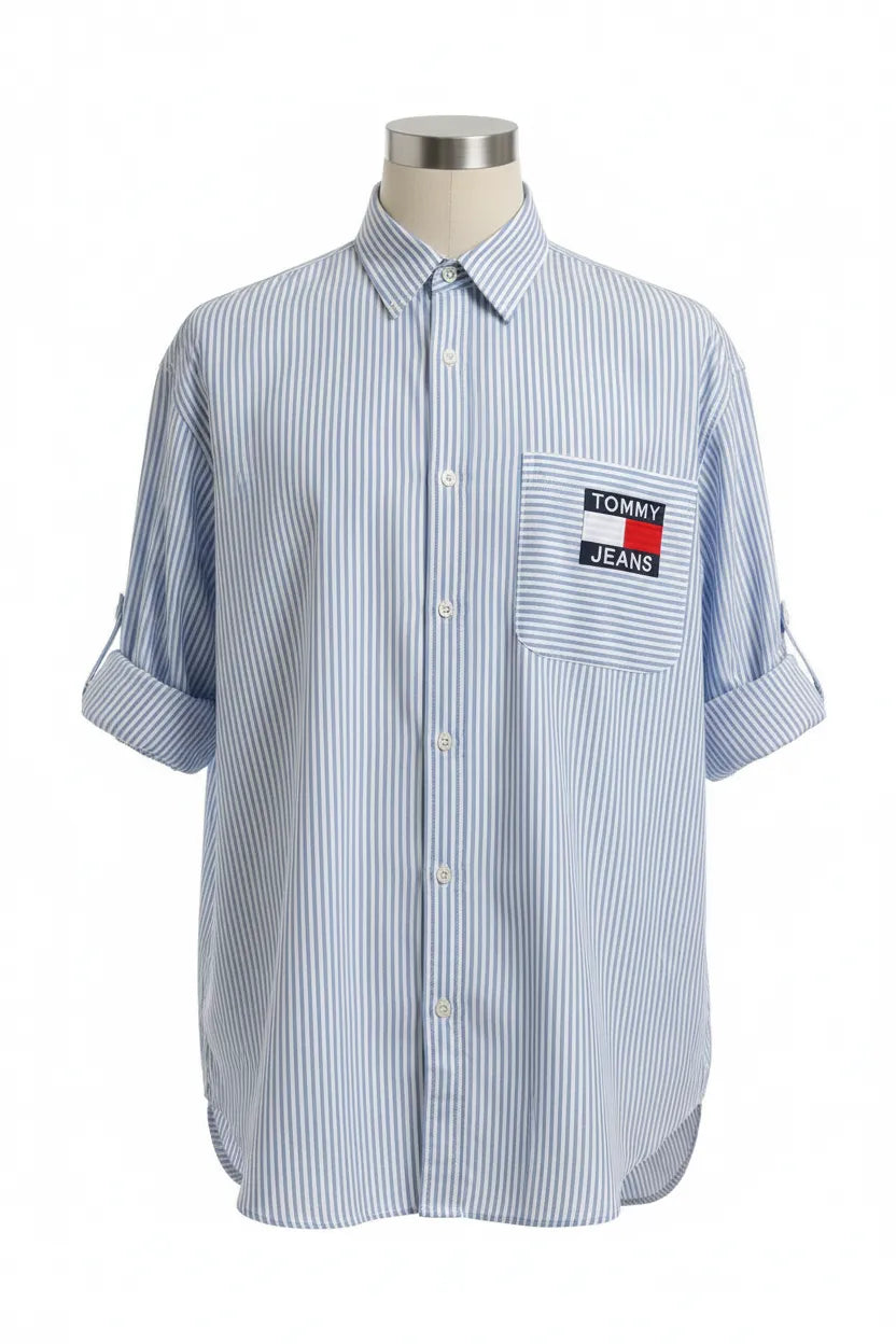 Blue and white striped shirt with Tommy Jeans logo on a mannequin against a white background
