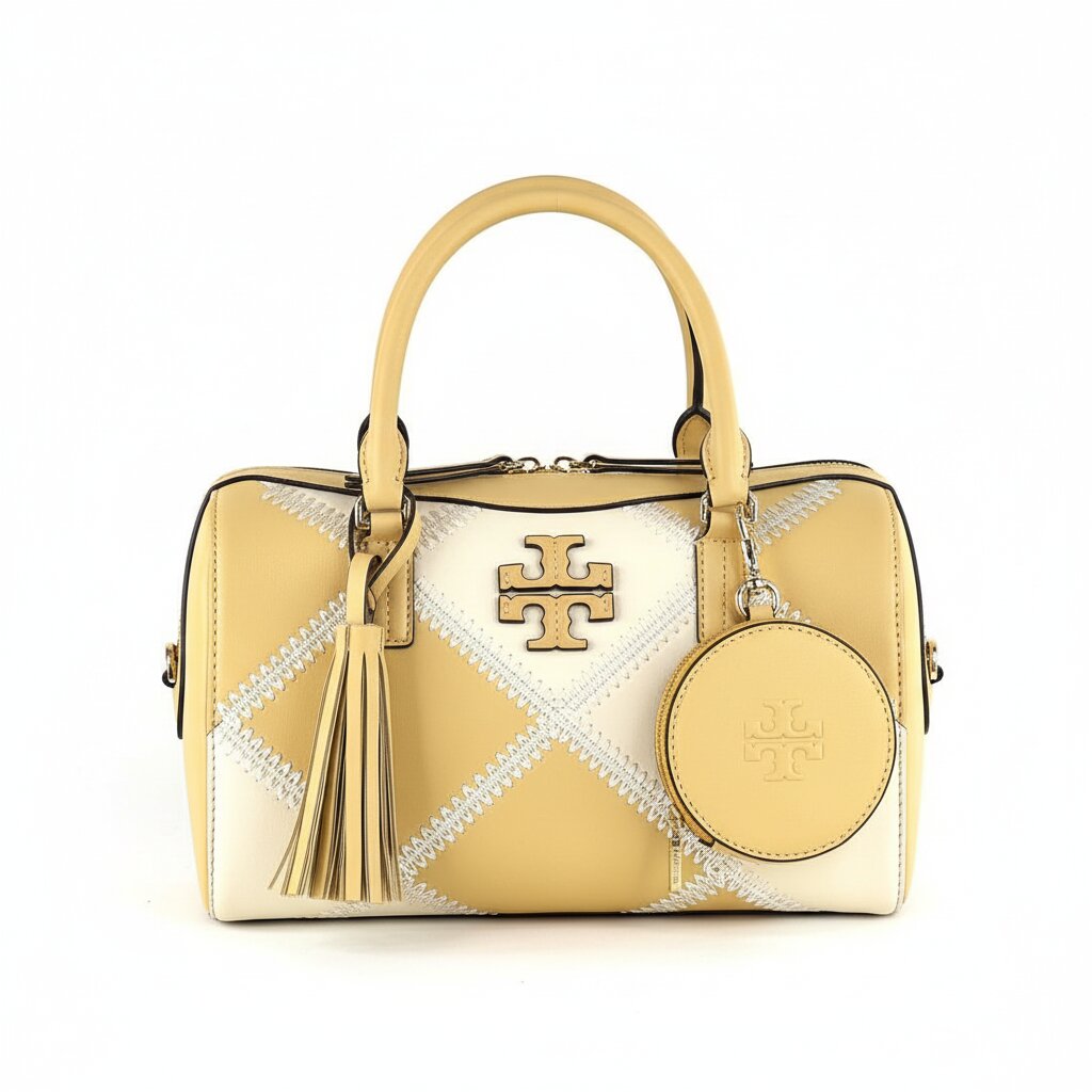 Stylish woman with Tory Burch Eleanor brown leather shoulder bag - professional photography
