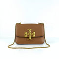 Tory Burch Eleanor brown leather shoulder bag with oversized gold TB logo on white background
