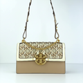 Tory Burch woven leather shoulder bag in beige with basketweave pattern and gold TB logo on white background
