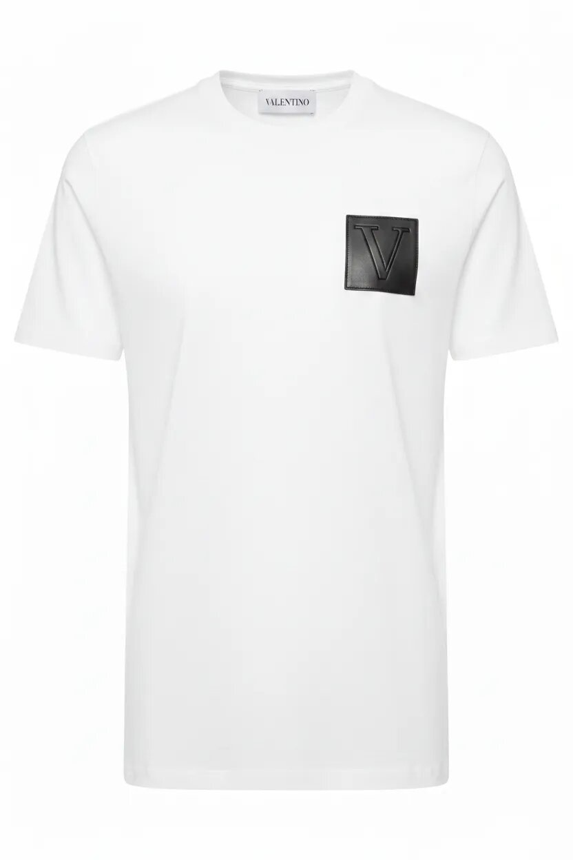 White t-shirt with a black logo patch on a white background