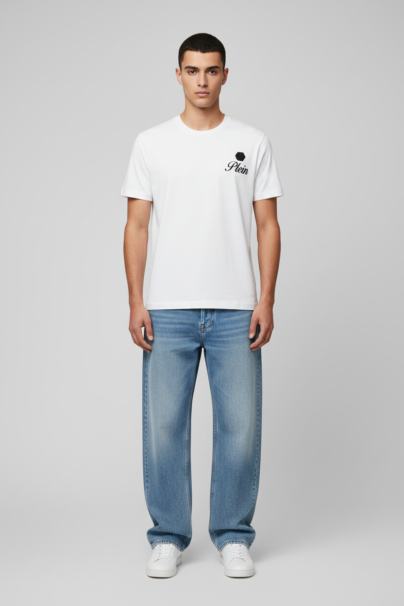Man wearing a white t-shirt with a black logo and text, paired with light blue jeans on a gray background
